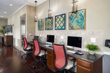 Business center with desk, chairs and computers